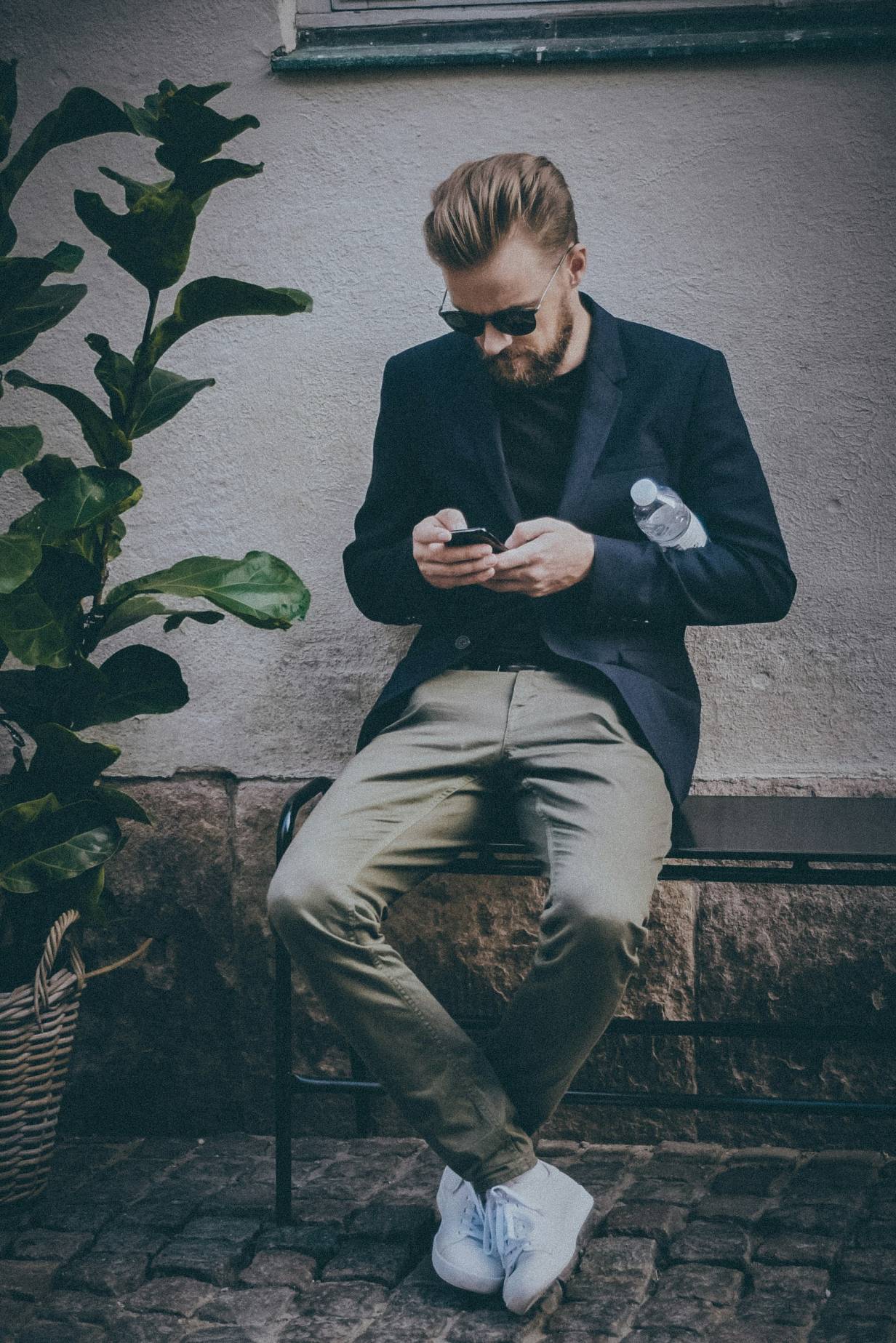 Image of a person using the app on a smartphone.